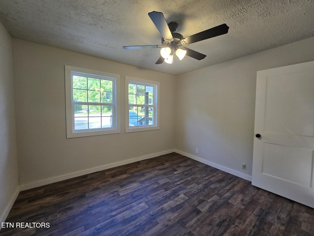 678 Skyline Dr, Oneida, TN 37841 - spare room featuring dark wood finished floors, a textured ceiling, ceiling fan, and baseboards