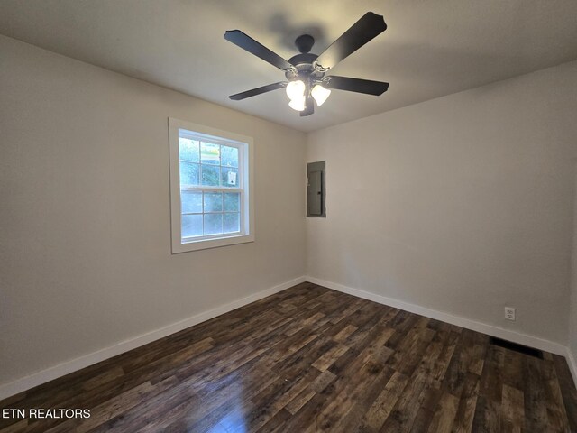 678 Skyline Dr, Oneida, TN 37841 - spare room with electric panel, dark wood finished floors, baseboards, and a ceiling fan