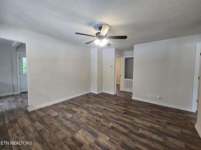 678 Skyline Dr, Oneida, TN 37841 - empty room with dark wood-style flooring, a ceiling fan, a textured ceiling, and baseboards