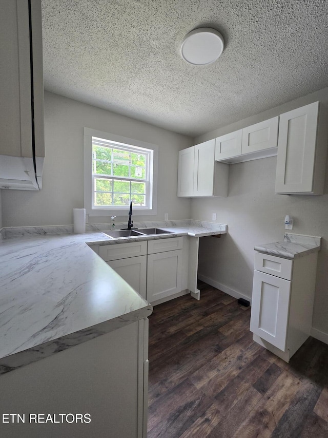 678 Skyline Dr, Oneida, TN 37841 - kitchen featuring a sink, white cabinets, a textured ceiling, dark wood-style floors, and baseboards