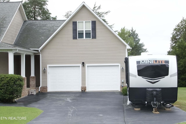 120 Lakeside Dr, Kingston, TN 37763 - view of property exterior with asphalt driveway and a garage