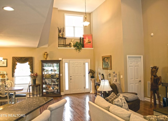 120 Lakeside Dr, Kingston, TN 37763 - living room featuring a towering ceiling, dark wood-style flooring, baseboards, recessed lighting, and a chandelier