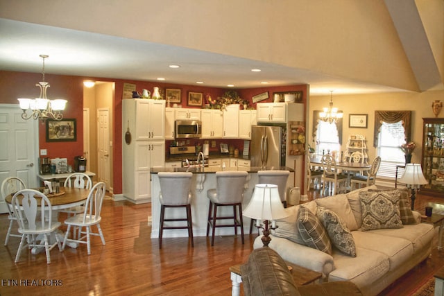 120 Lakeside Dr, Kingston, TN 37763 - living area with a chandelier, dark wood-style flooring, a high ceiling, and recessed lighting