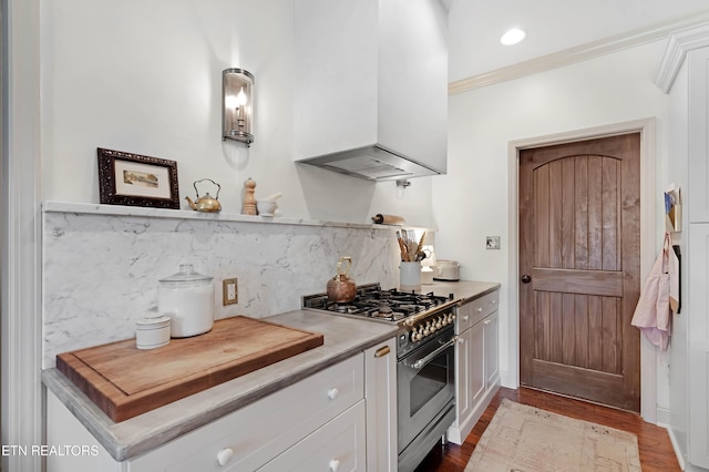 2811 Pleasant View Ave, Maryville, TN 37803 - kitchen featuring high end stove, custom exhaust hood, white cabinetry, tasteful backsplash, and wood finished floors
