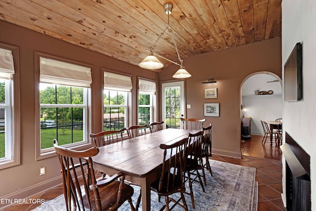 2811 Pleasant View Ave, Maryville, TN 37803 - dining area featuring dark tile patterned flooring, arched walkways, plenty of natural light, and wooden ceiling