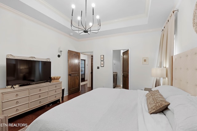 2811 Pleasant View Ave, Maryville, TN 37803 - bedroom with a chandelier, ornamental molding, dark wood-style flooring, a raised ceiling, and ensuite bath