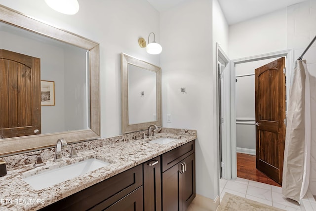 2811 Pleasant View Ave, Maryville, TN 37803 - full bathroom with double vanity, tile patterned floors, a shower with curtain, and baseboards