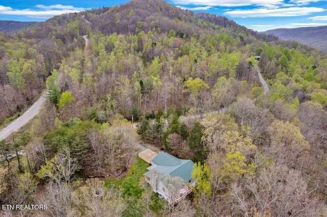 108 W Bobcat Ln, Wilder, TN 38589 - aerial view of property and surrounding area featuring a heavily wooded area and mountains