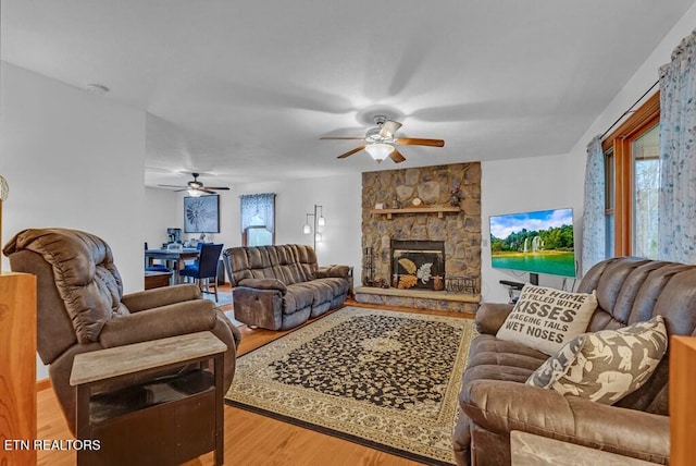108 W Bobcat Ln, Wilder, TN 38589 - living area with ceiling fan, light wood finished floors, and a fireplace
