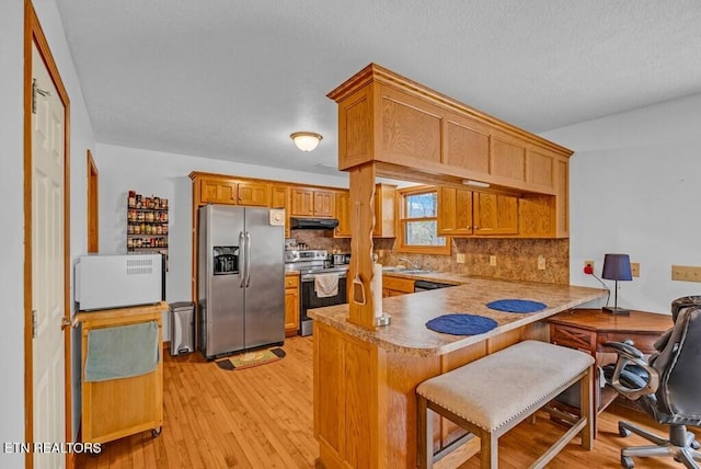 108 W Bobcat Ln, Wilder, TN 38589 - kitchen featuring appliances with stainless steel finishes, a peninsula, backsplash, and a sink
