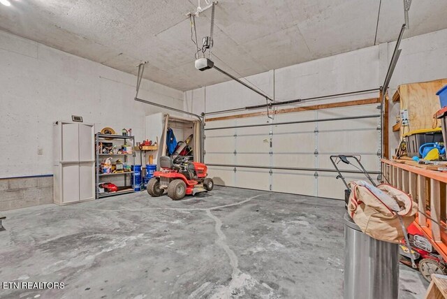 108 W Bobcat Ln, Wilder, TN 38589 - garage featuring a garage door opener