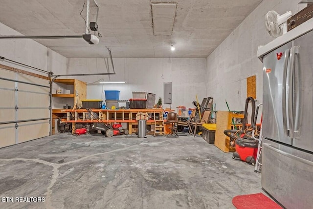 108 W Bobcat Ln, Wilder, TN 38589 - garage with freestanding refrigerator and electric panel