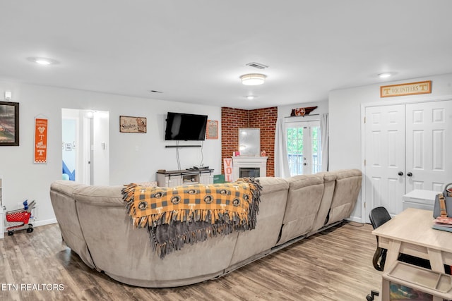 6608 Hickory Way Ln, Knoxville, TN 37918 - living area featuring wood finished floors, baseboards, and a brick fireplace