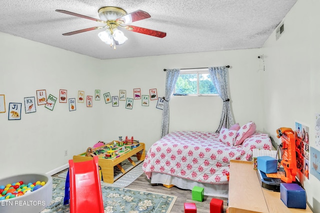 6608 Hickory Way Ln, Knoxville, TN 37918 - bedroom with a textured ceiling, wood finished floors, and ceiling fan