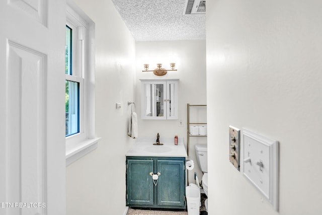 6608 Hickory Way Ln, Knoxville, TN 37918 - half bathroom featuring vanity, toilet, and a textured ceiling