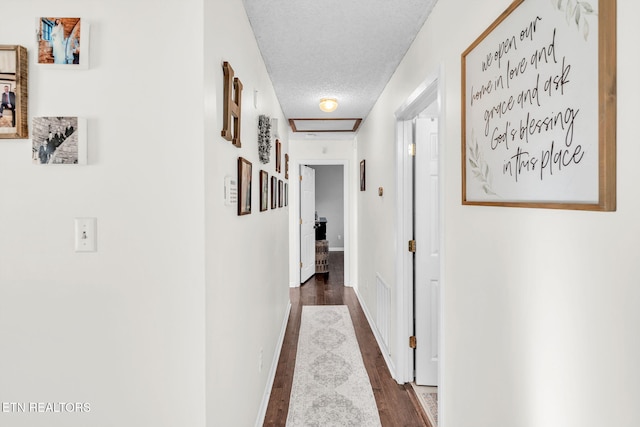 6608 Hickory Way Ln, Knoxville, TN 37918 - hallway featuring a textured ceiling, wood finished floors, and baseboards