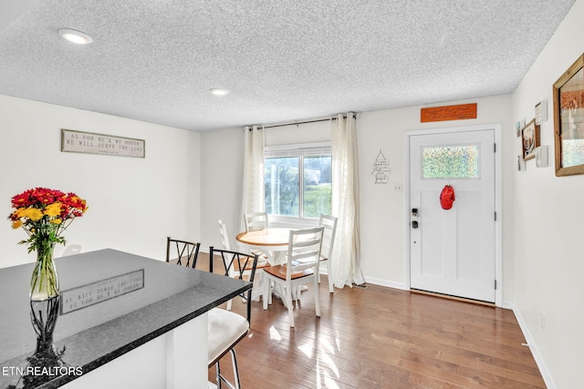 6608 Hickory Way Ln, Knoxville, TN 37918 - dining room featuring a textured ceiling, recessed lighting, hardwood / wood-style flooring, and baseboards