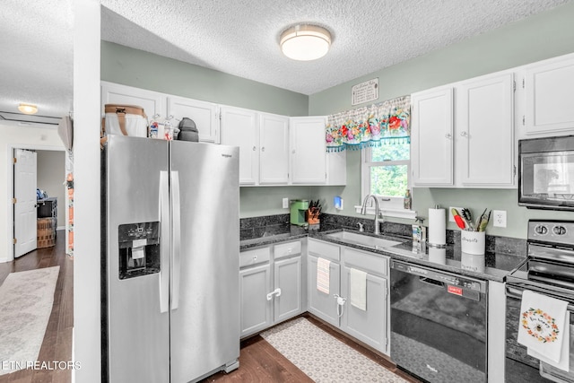 6608 Hickory Way Ln, Knoxville, TN 37918 - kitchen with black appliances, a sink, a textured ceiling, white cabinets, and dark wood-style floors