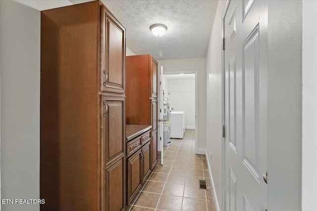68 Pine Mountain Cir, Pineville, KY 40977 - hallway featuring tile patterned flooring, washer / clothes dryer, and baseboards