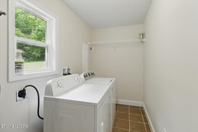 68 Pine Mountain Cir, Pineville, KY 40977 - laundry area featuring washer and dryer, dark tile patterned flooring, and baseboards