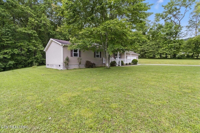 68 Pine Mountain Cir, Pineville, KY 40977 - view of front facade with crawl space, a front yard, and an attached garage