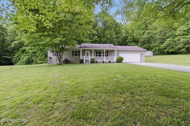 68 Pine Mountain Cir, Pineville, KY 40977 - view of front of house featuring a porch, concrete driveway, an attached garage, and a front yard