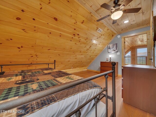 1027 Leslie Way, Sevierville, TN 37876 - bedroom featuring wood ceiling, wood finished floors, lofted ceiling, recessed lighting, and wood walls