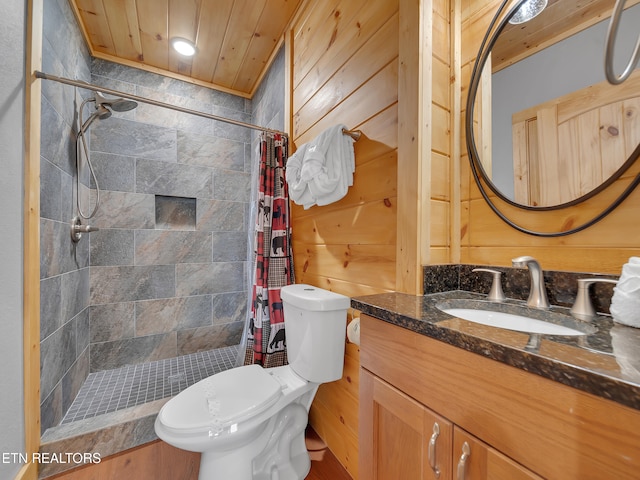 1027 Leslie Way, Sevierville, TN 37876 - full bath with toilet, vanity, a shower stall, and wood walls