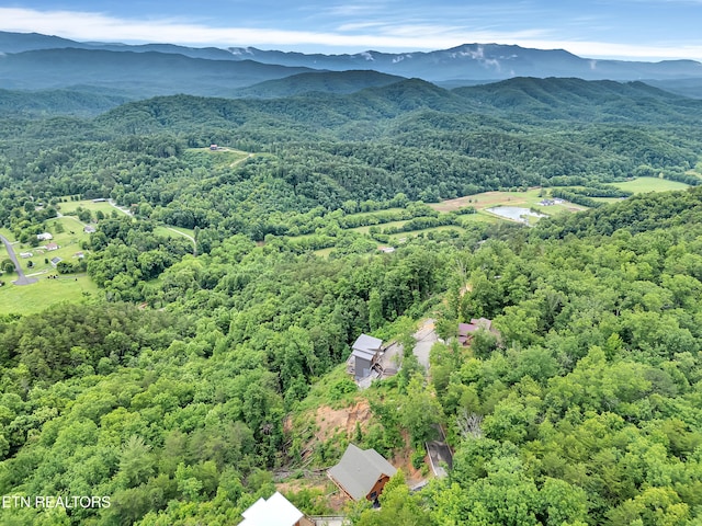 1027 Leslie Way, Sevierville, TN 37876 - drone / aerial view of a heavily wooded area and a mountainous background