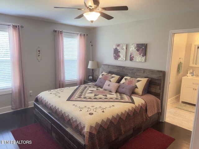 323 Wilson Hurst St, Tazewell, TN 37879 - bedroom with multiple windows, dark wood-style flooring, ceiling fan, and baseboards