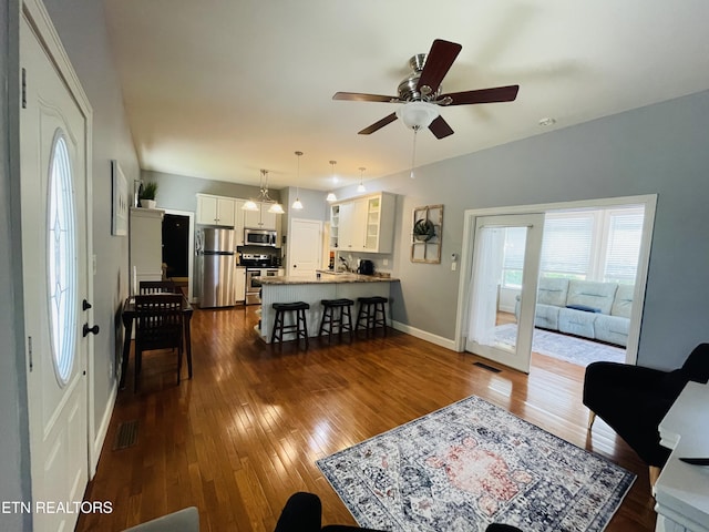 5422 Cricket Ln, Walland, TN 37886 - living room with dark wood-type flooring, ceiling fan, and baseboards