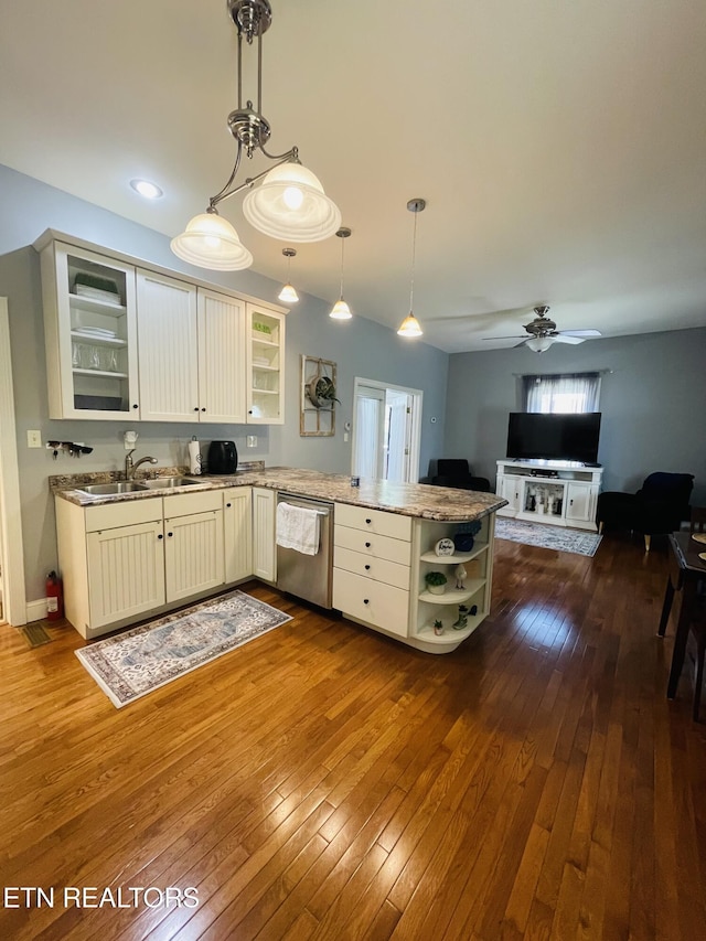 5422 Cricket Ln, Walland, TN 37886 - kitchen with stainless steel dishwasher, open shelves, a sink, a peninsula, and dark wood-style floors