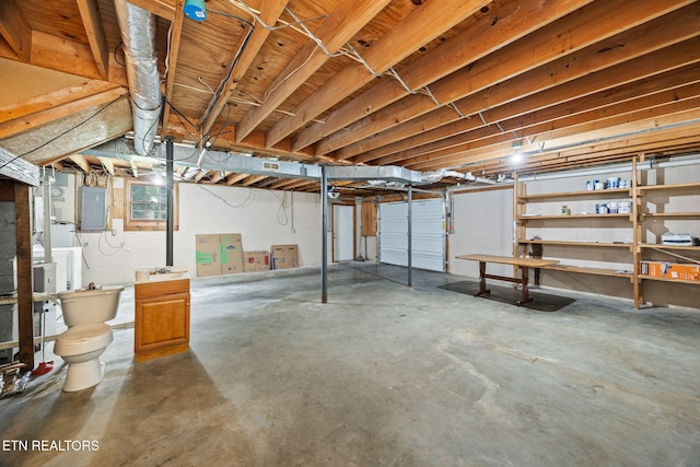1036 Hawthorn Dr, Cookeville, TN 38501 - unfinished basement featuring electric panel and independent washer and dryer