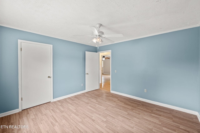 1036 Hawthorn Dr, Cookeville, TN 38501 - unfurnished bedroom with wood finished floors, a textured ceiling, baseboards, crown molding, and a ceiling fan