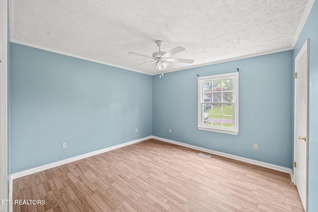 1036 Hawthorn Dr, Cookeville, TN 38501 - spare room with a textured ceiling, wood finished floors, a ceiling fan, crown molding, and baseboards