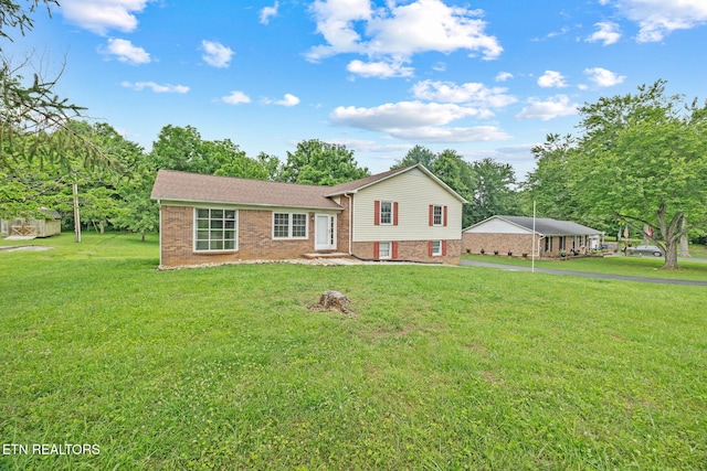 1036 Hawthorn Dr, Cookeville, TN 38501 - tri-level home with brick siding, a front yard, and driveway