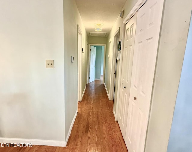 4721 Springcrest Dr, Knoxville, TN 37914 - corridor featuring wood finished floors, baseboards, and attic access