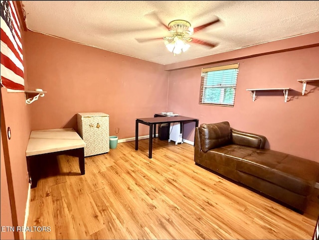 4721 Springcrest Dr, Knoxville, TN 37914 - sitting room featuring ceiling fan, light wood finished floors, a textured ceiling, and baseboards