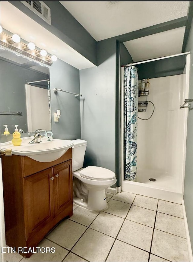 4721 Springcrest Dr, Knoxville, TN 37914 - full bathroom featuring tile patterned floors, vanity, toilet, and a shower stall