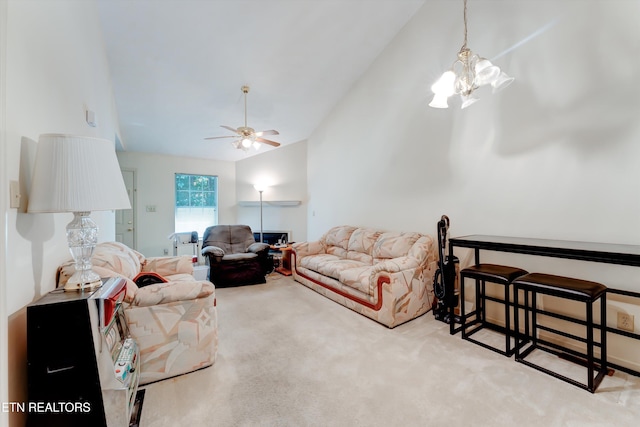 692 Shadywood Ln, Knoxville, TN 37923 - carpeted living room featuring a chandelier, a ceiling fan, and high vaulted ceiling