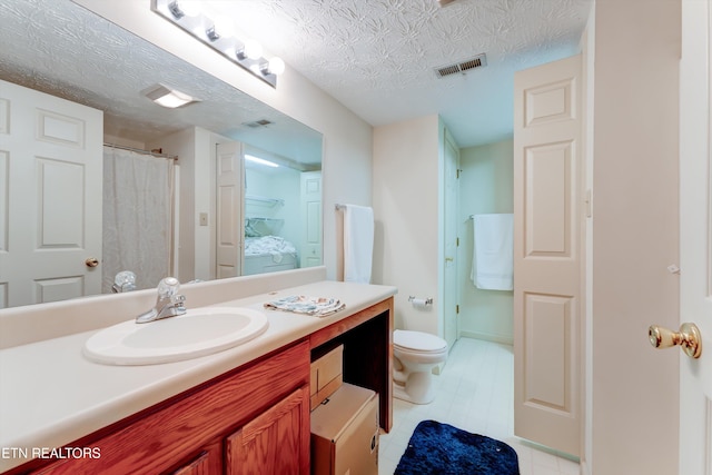 692 Shadywood Ln, Knoxville, TN 37923 - full bathroom with vanity, toilet, a textured ceiling, and tile patterned floors