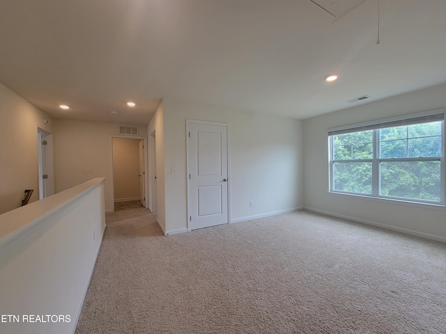12043 Lillibridge Crossing Ln, Knoxville, TN 37932 - empty room featuring recessed lighting, light carpet, baseboards, and attic access