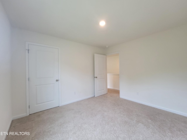 12043 Lillibridge Crossing Ln, Knoxville, TN 37932 - unfurnished bedroom featuring light carpet and baseboards