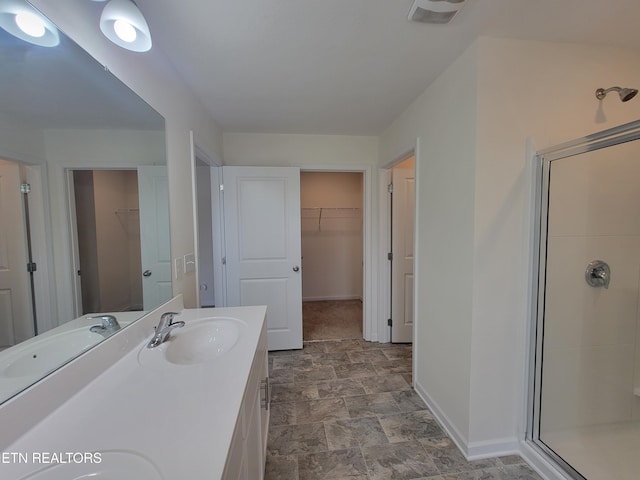12043 Lillibridge Crossing Ln, Knoxville, TN 37932 - bathroom with a stall shower, a spacious closet, and double vanity