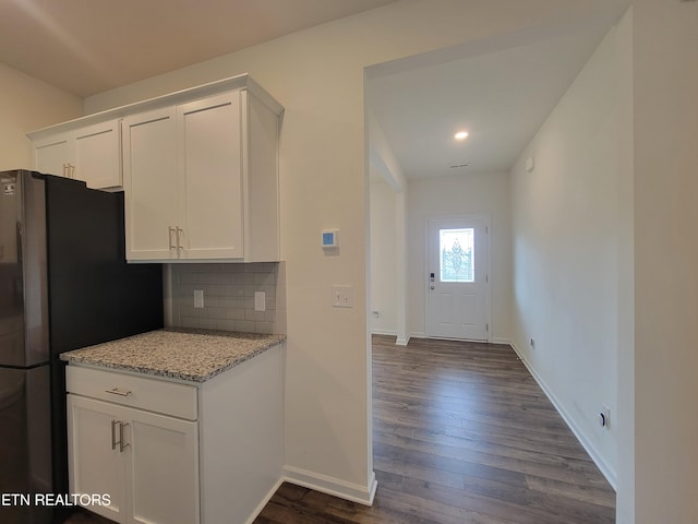 12043 Lillibridge Crossing Ln, Knoxville, TN 37932 - kitchen with white cabinetry, freestanding refrigerator, dark wood finished floors, backsplash, and baseboards