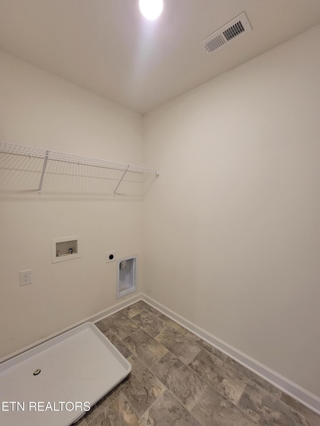 12043 Lillibridge Crossing Ln, Knoxville, TN 37932 - laundry area featuring hookup for an electric dryer, hookup for a washing machine, and baseboards