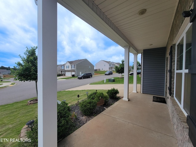 12043 Lillibridge Crossing Ln, Knoxville, TN 37932 - covered porch with a residential view and a lawn