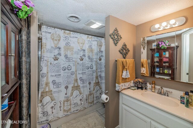 1081 Cove Rd Apt 1022, Sevierville, TN 37876 - bathroom featuring vanity, tile patterned floors, and a textured ceiling