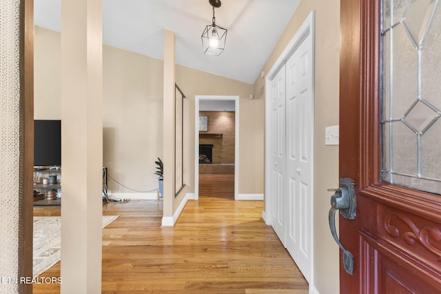 120 Cooper Cir, Oak Ridge, TN 37830 - entryway featuring light wood finished floors, vaulted ceiling, baseboards, and a fireplace