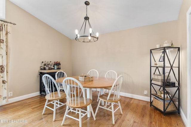 120 Cooper Cir, Oak Ridge, TN 37830 - dining space featuring light wood-style floors, a chandelier, baseboards, and lofted ceiling